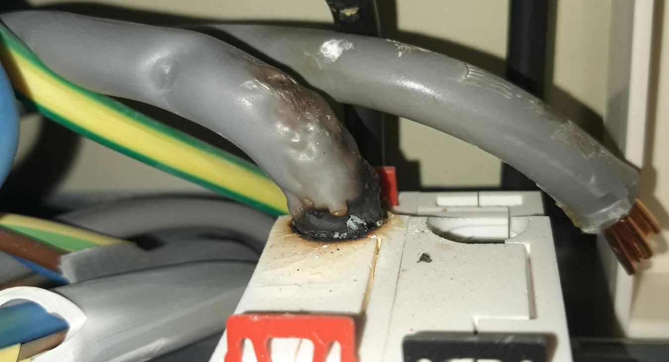 Dangerous Main Switch Terminal: A Burnt Out Hazard Revealed by Our Expert Chatham Electrician!