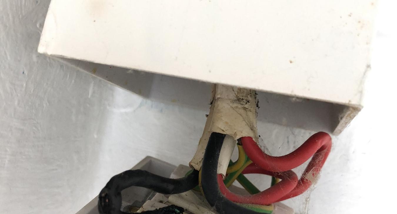 burning fishy smell coming from a burnt shower isolator due to poor electrical connection