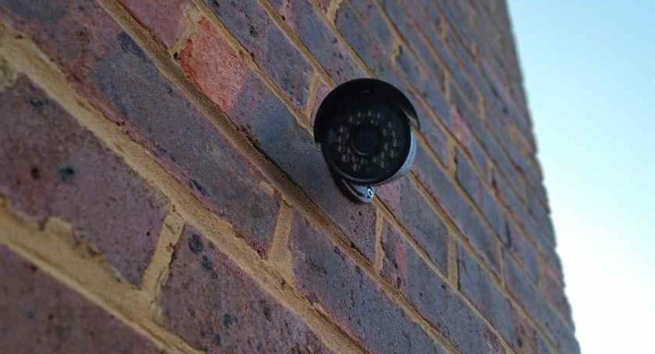 Outside CCTV camera covering alleyway along house in Hempstead, Gillingham