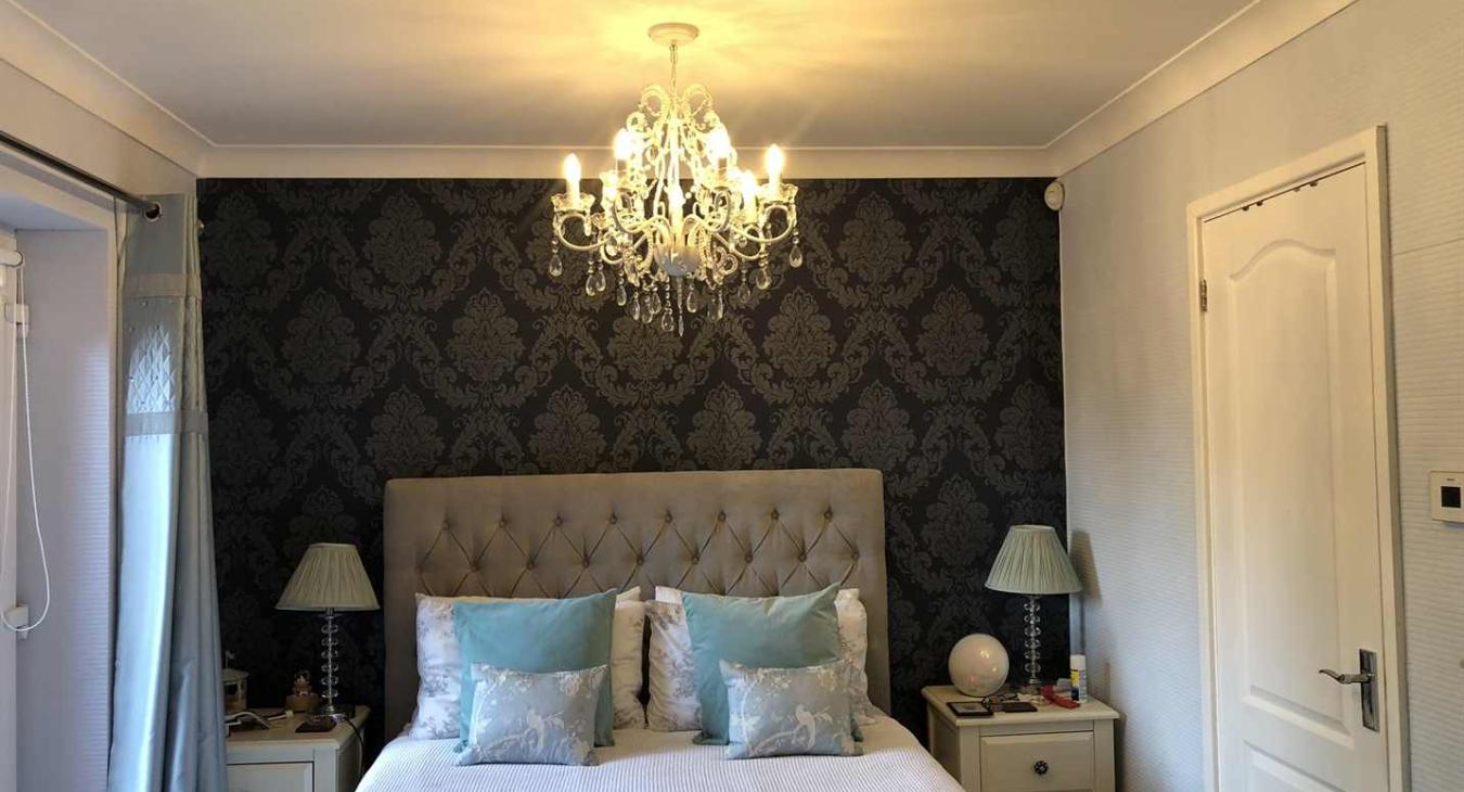 Hotel style bedroom finished off with the perfect light fitting by local electrician