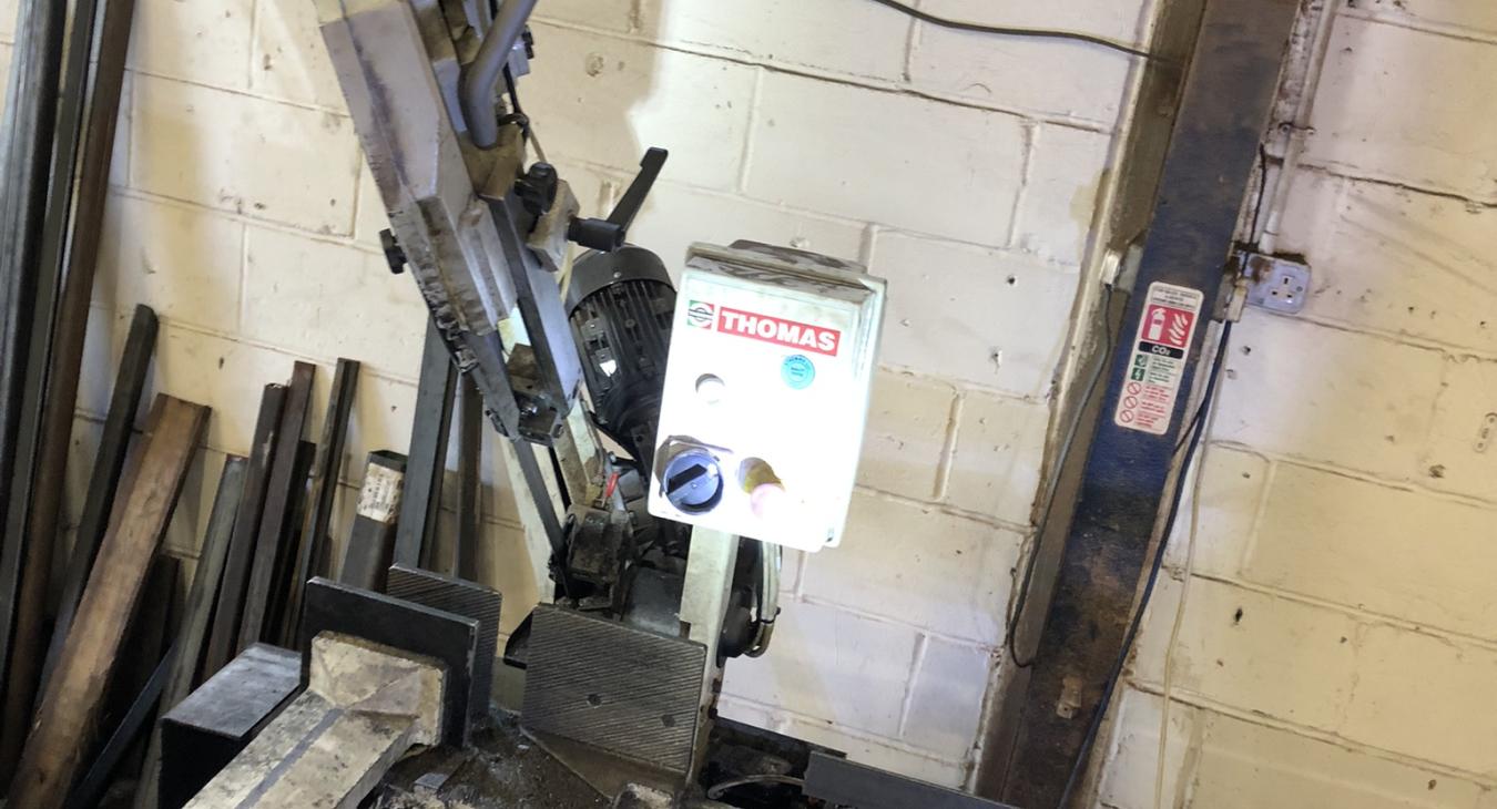 Our commercial electrician fixing a 3 phase metal saw in a fabrication workshop in Rainham