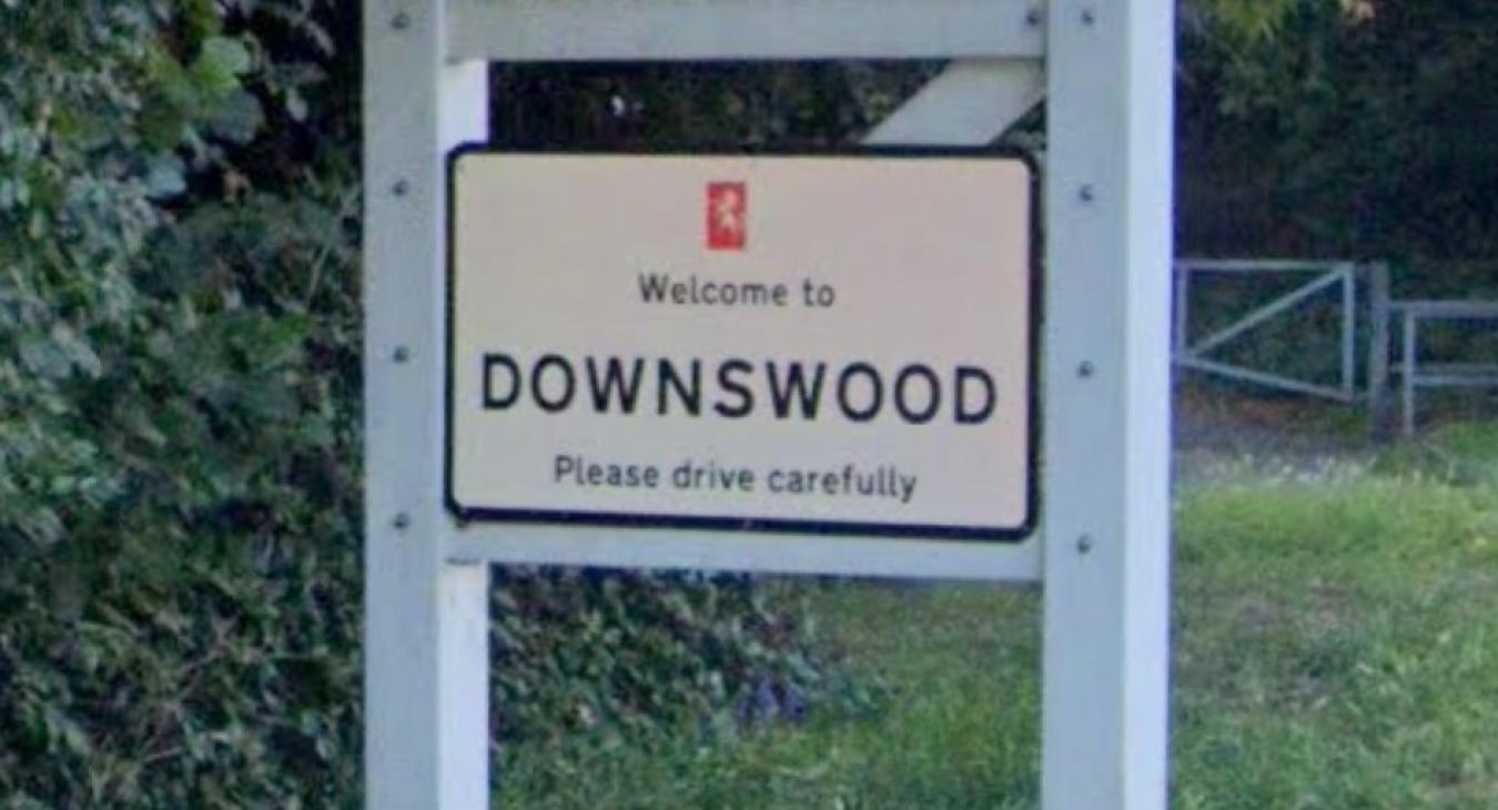 Electrician shows Downswood road sign in Maidstone