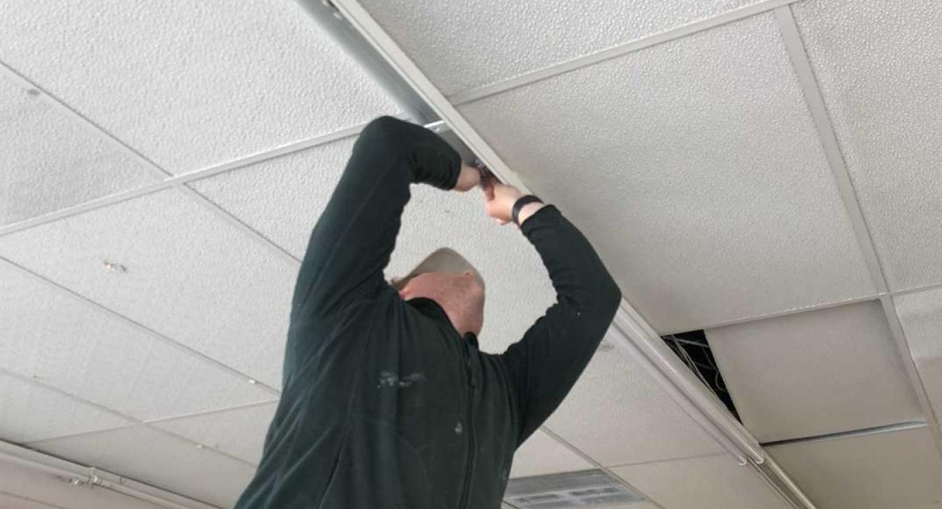 commercial electrician fitting ceiling lights